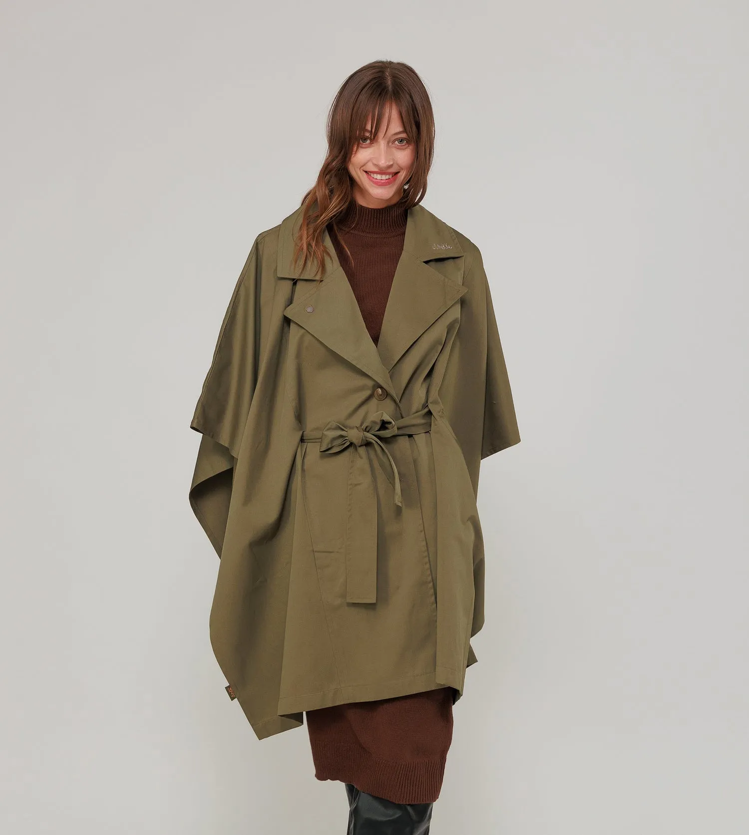 Green cape-style trench coat